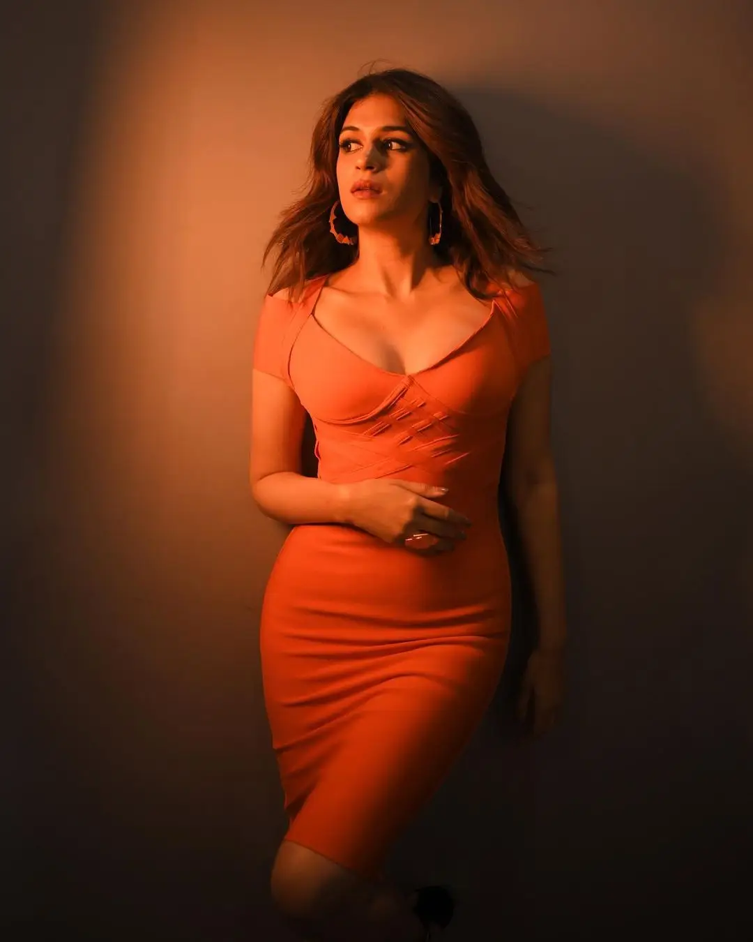 Shraddha Das Long Legs Show in Orange Mini Skirt